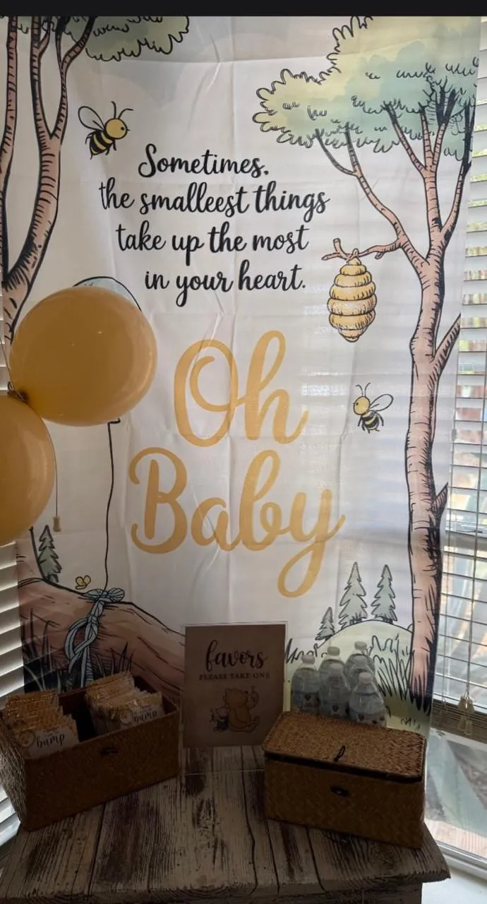 Oh Baby woodland backdrop with gift boxes and pastel balloons